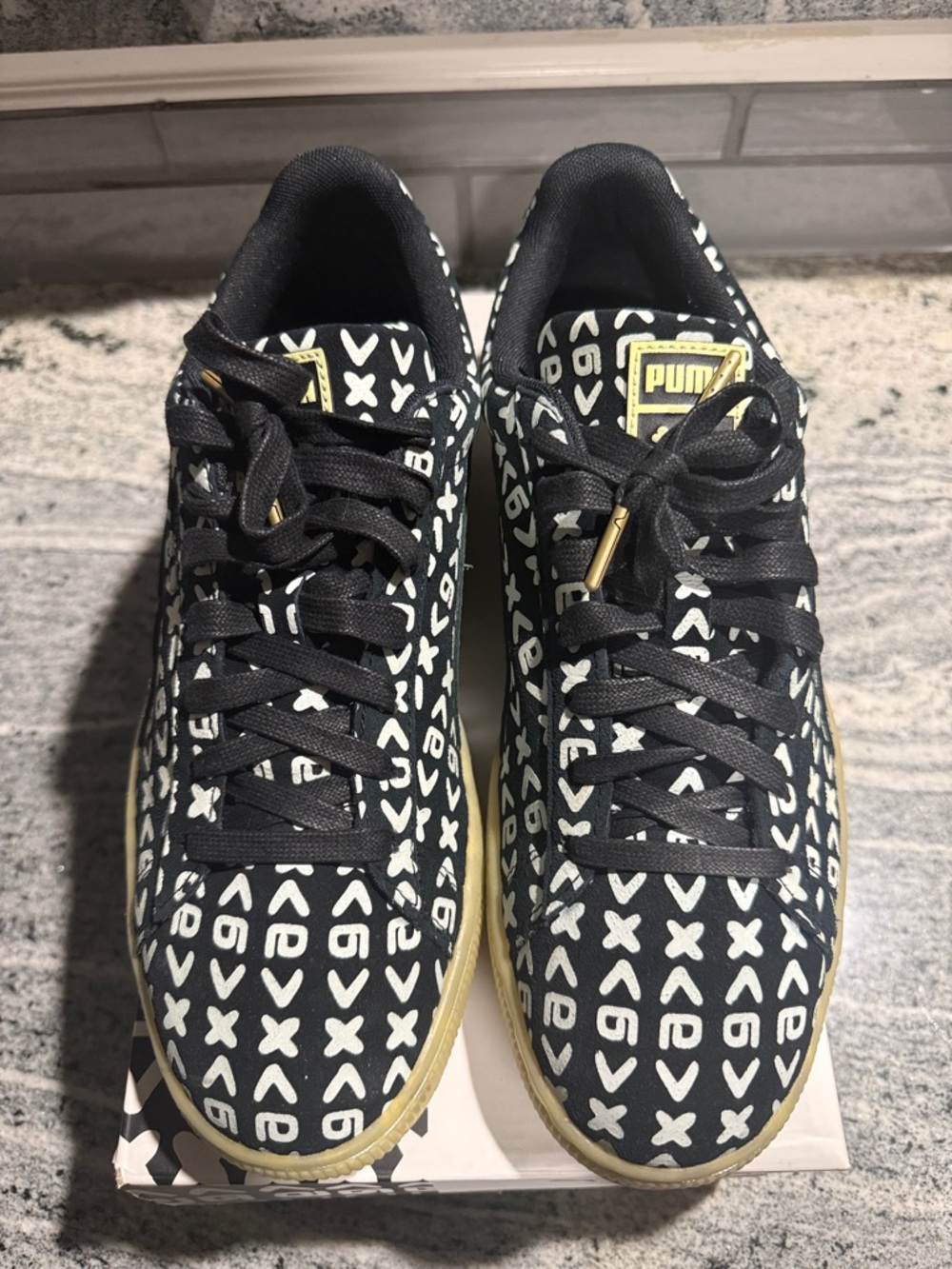 PUMA “Zamunda” Black & White Patterned Sneakers with Gold Accents